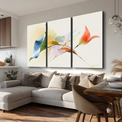 Airy green, orange and blue organic shapes floating across a white background 3 piece canvas wall art room and product view