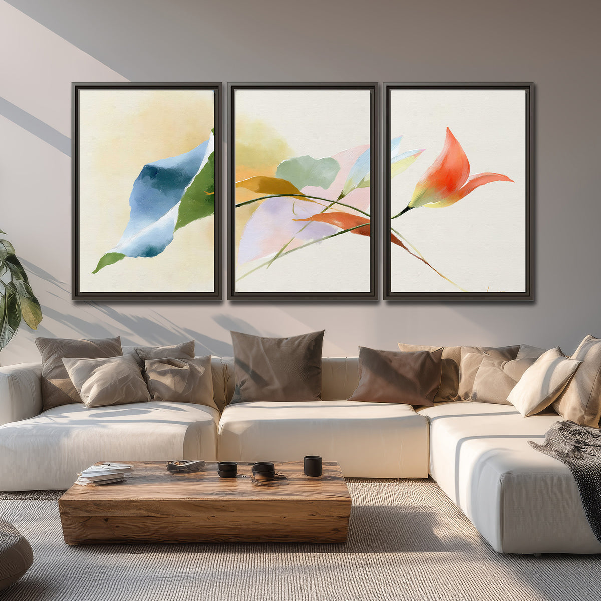 Airy green, orange and blue organic shapes floating across a white background 3 piece framed canvas wall art displayed in a living room