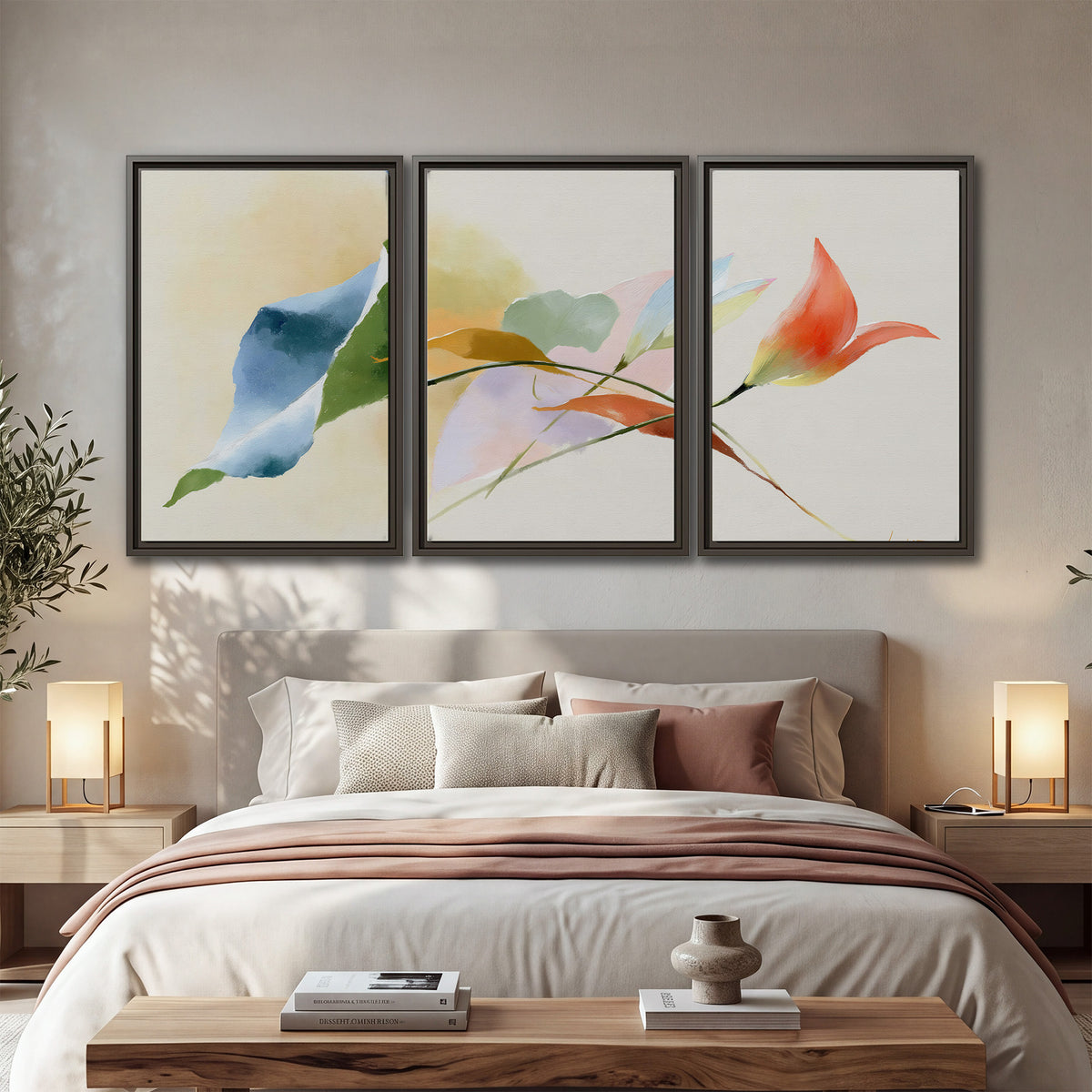 Airy green, orange and blue organic shapes floating across a white background 3 piece framed canvas wall art displayed in a bedroom