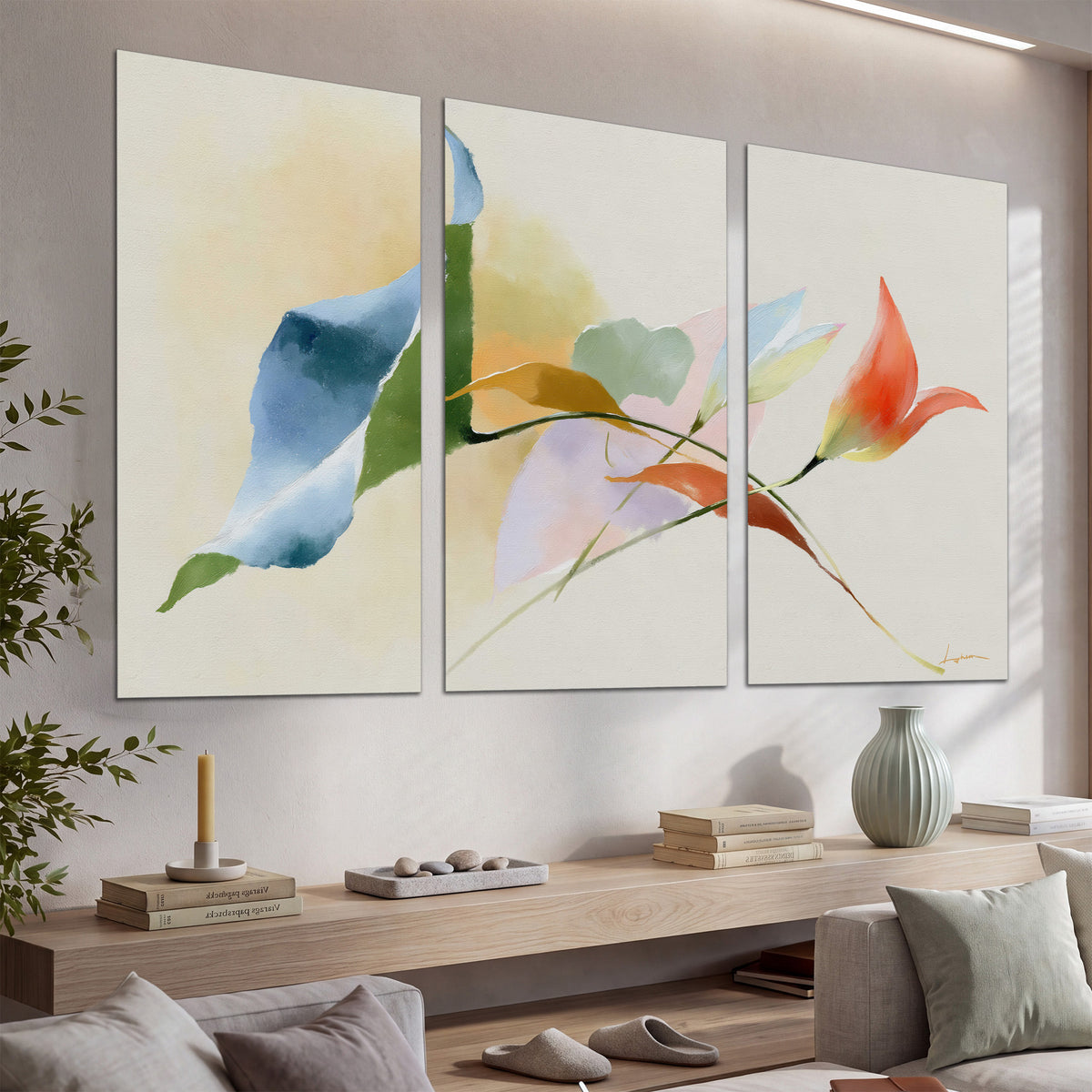 Airy green, orange and blue organic shapes floating across a white background set of 3 poster prints displayed in a console