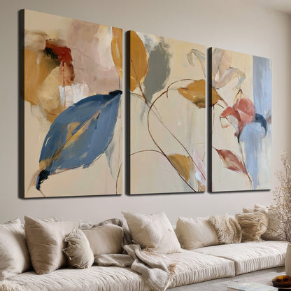 Loose ochre, blue and pink leaves arranged on a pale layered background 3 piece canvas wall art room and product view