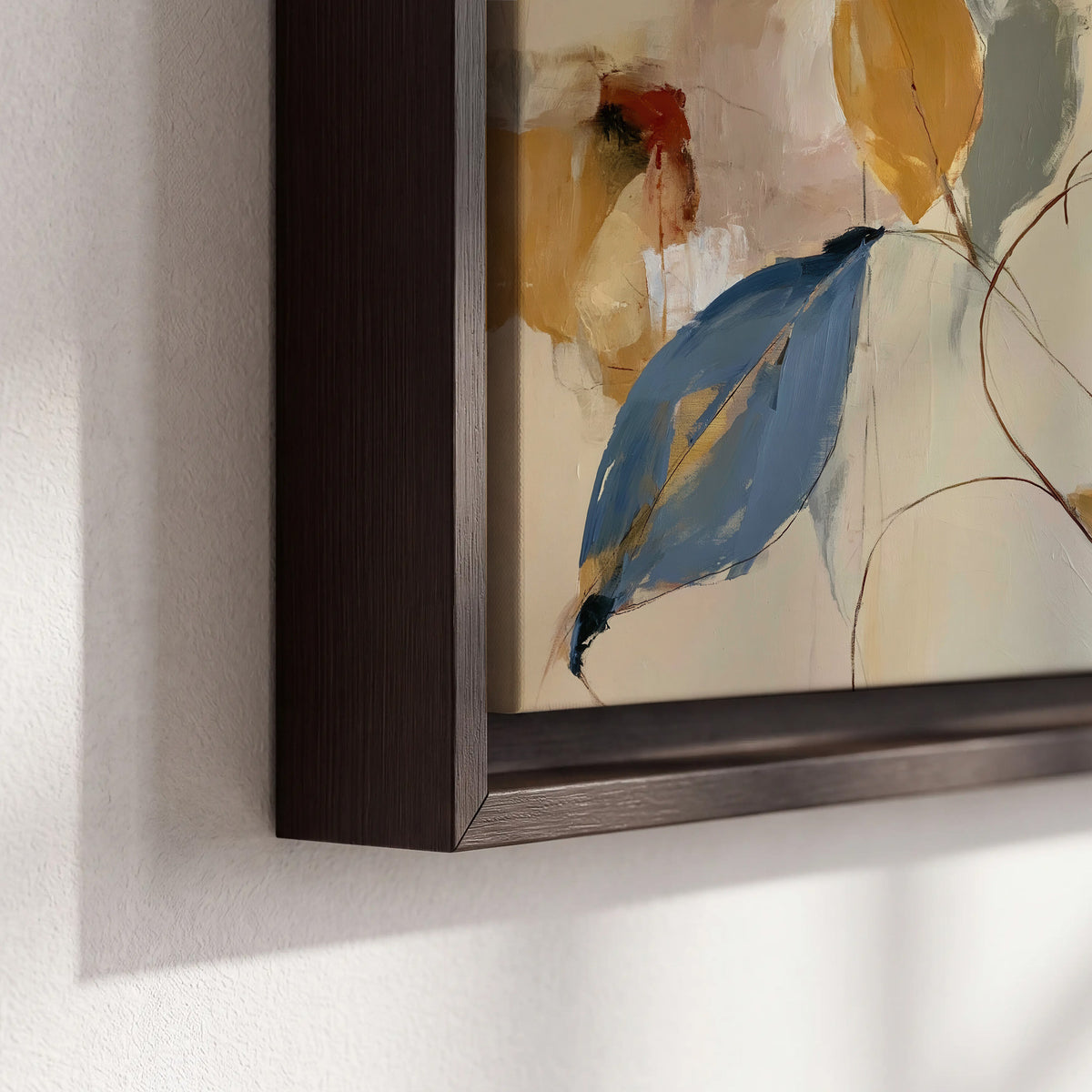 Loose ochre, blue and pink leaves arranged on a pale layered background 3 piece framed canvas wall art material and edge close up