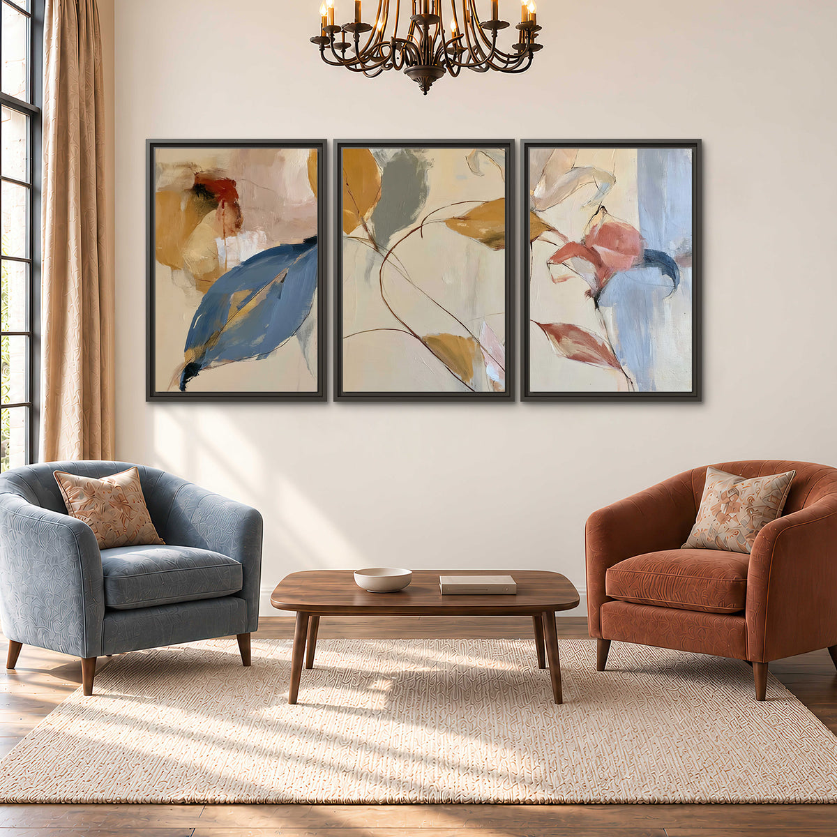 Loose ochre, blue and pink leaves arranged on a pale layered background 3 piece framed canvas wall art styled in an interior