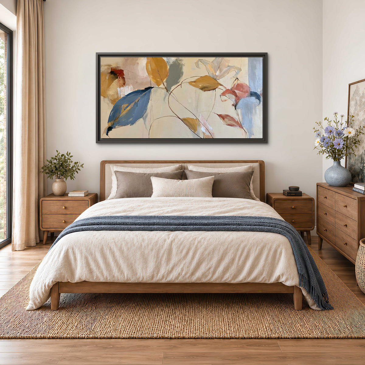 Loose ochre, blue and pink leaves arranged on a pale layered background single framed canvas wall art styled in an interior