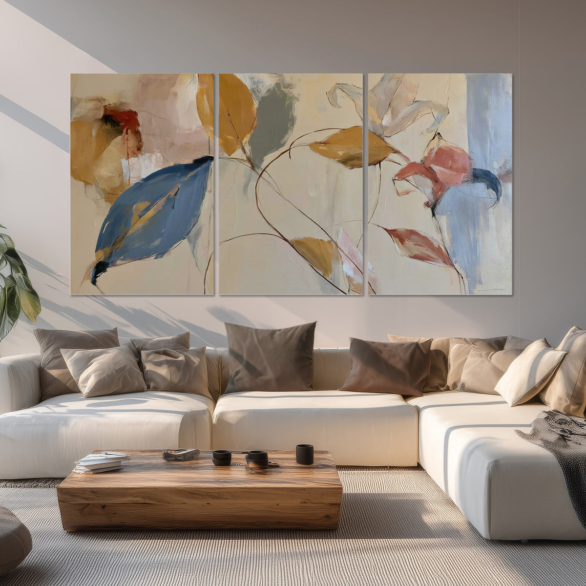 Loose ochre, blue and pink leaves arranged on a pale layered background set of 3 poster prints displayed in a living room