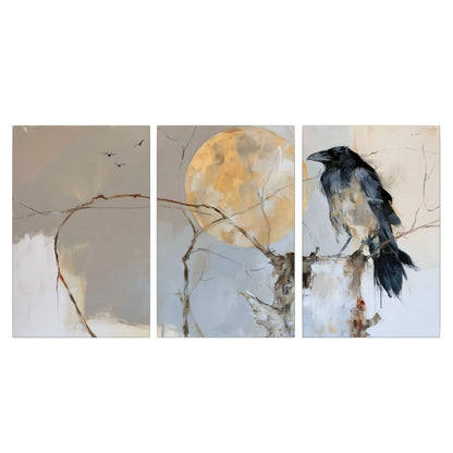 A dark raven beside a golden moon amid pale blue and cream painterly strokes 3 piece canvas wall art viewed straight on