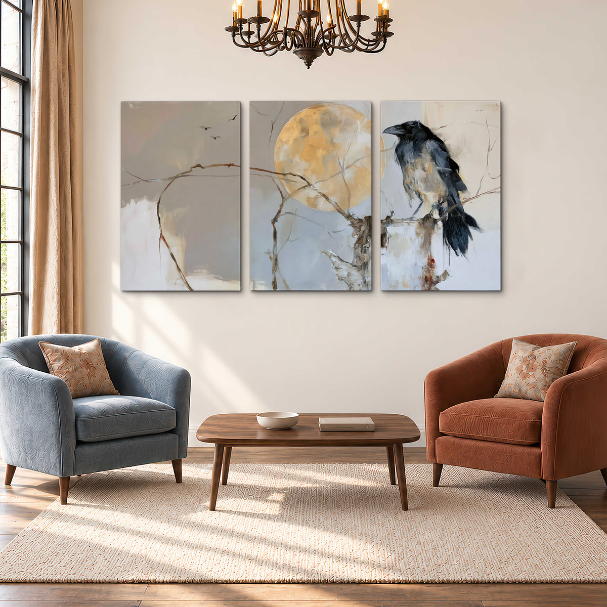 A dark raven beside a golden moon amid pale blue and cream painterly strokes 3 piece canvas wall art styled in an interior