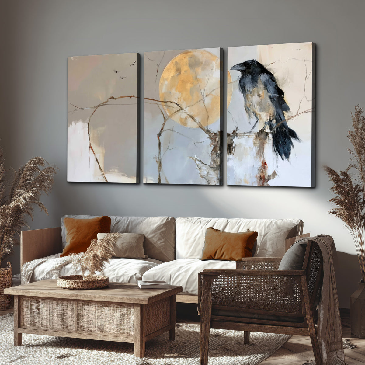 A dark raven beside a golden moon amid pale blue and cream painterly strokes 3 piece canvas wall art displayed in a rustic living room