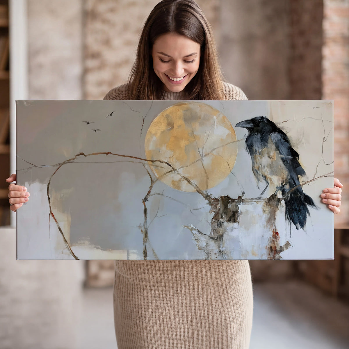 A dark raven beside a golden moon amid pale blue and cream painterly strokes single canvas wall art held in hands