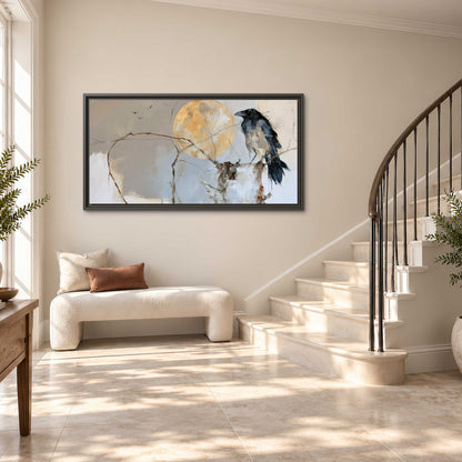 A dark raven beside a golden moon amid pale blue and cream painterly strokes single framed canvas wall art styled in an interior