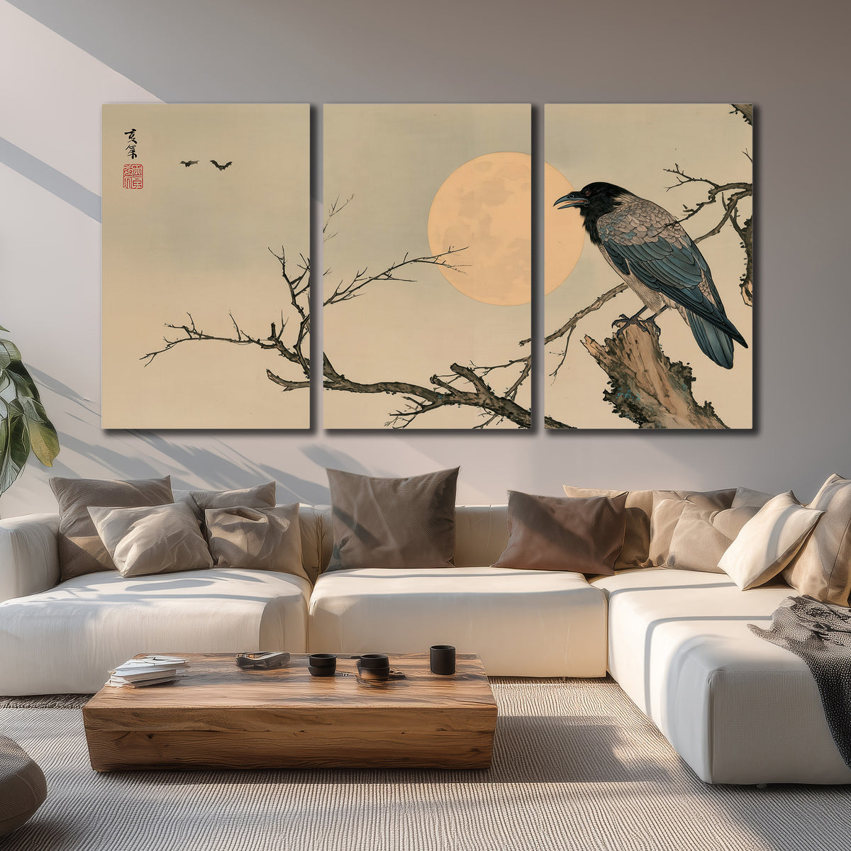 A dark raven perched on a bare branch beside a warm full moon 3 piece canvas wall art displayed in a living room