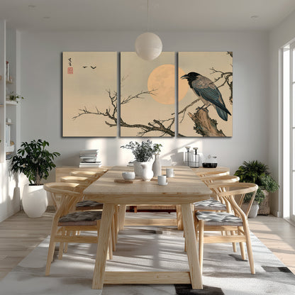 A dark raven perched on a bare branch beside a warm full moon 3 piece canvas wall art room and product view