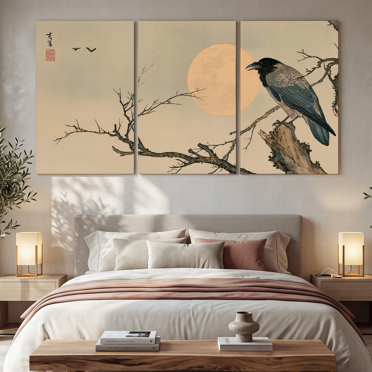 A dark raven perched on a bare branch beside a warm full moon 3 piece canvas wall art displayed in a bedroom