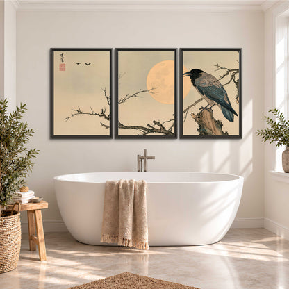 A dark raven perched on a bare branch beside a warm full moon 3 piece framed canvas wall art styled in an interior