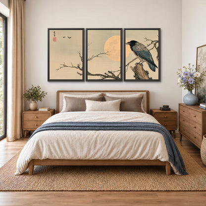 A dark raven perched on a bare branch beside a warm full moon 3 piece framed canvas wall art styled in an interior