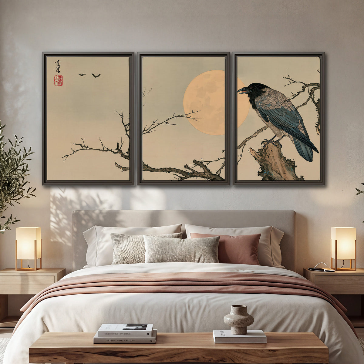 A dark raven perched on a bare branch beside a warm full moon 3 piece framed canvas wall art displayed in a bedroom