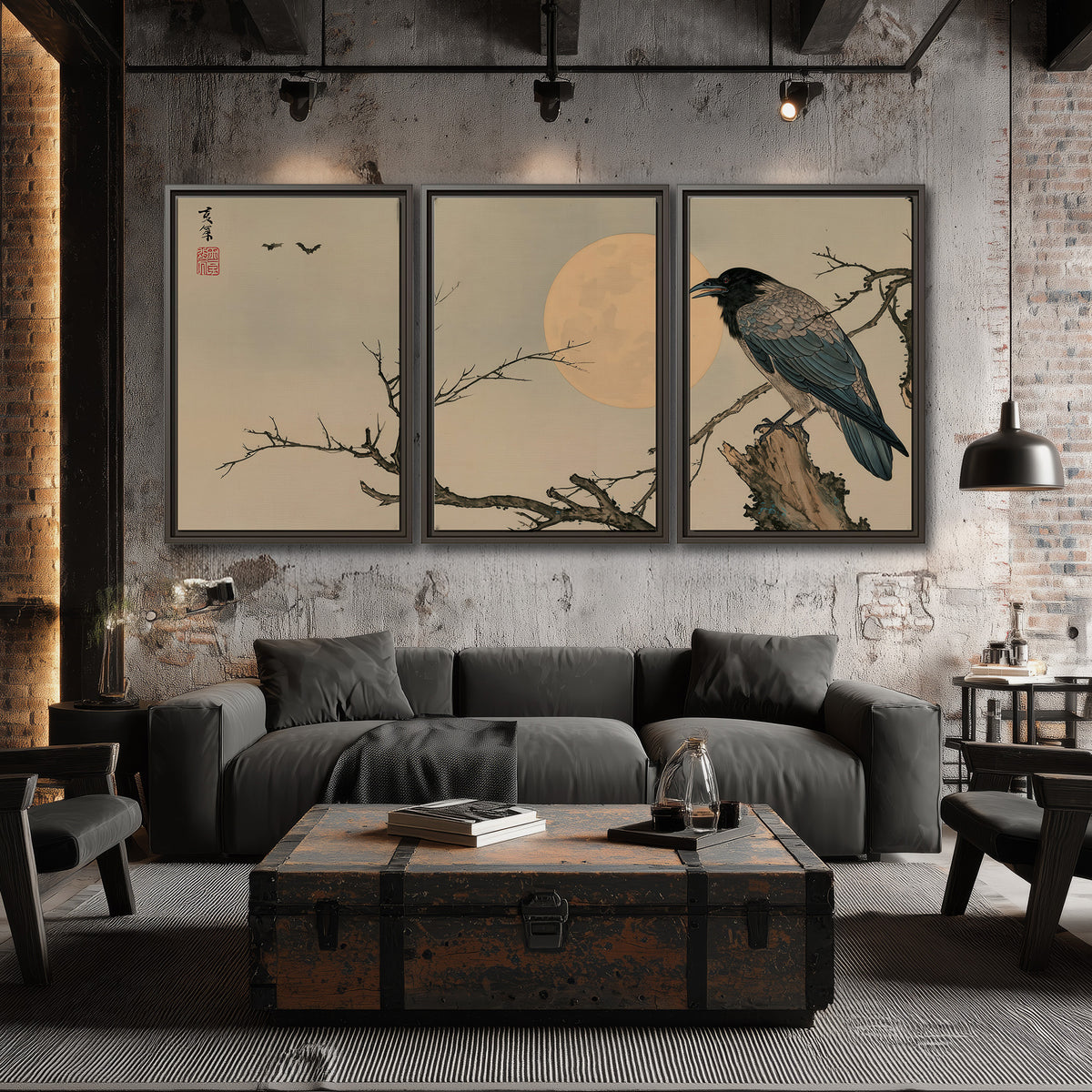 A dark raven perched on a bare branch beside a warm full moon 3 piece framed canvas wall art displayed in a industrial room