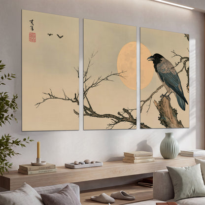 A dark raven perched on a bare branch beside a warm full moon set of 3 poster prints displayed in a console