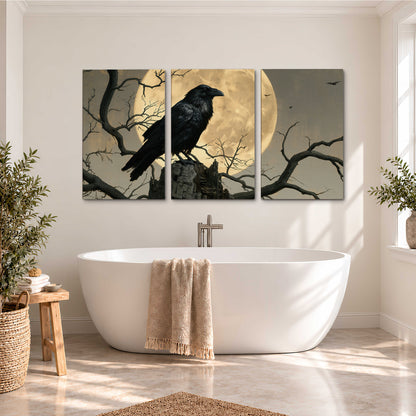 A black raven standing among bare branches in front of a large golden moon 3 piece canvas wall art styled in an interior