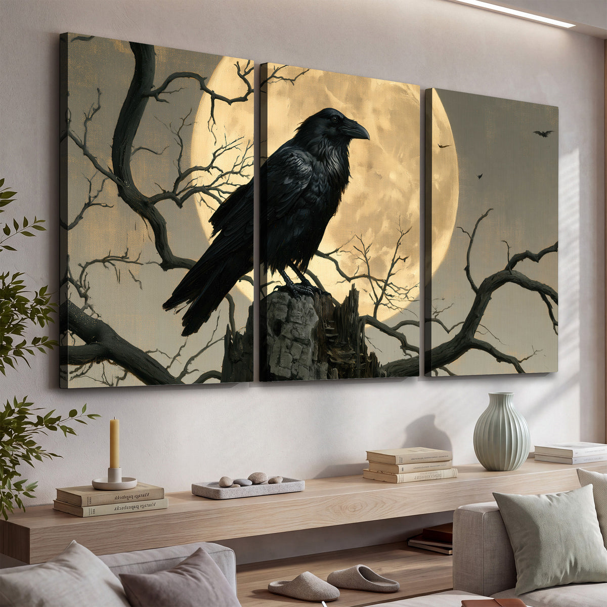 A black raven standing among bare branches in front of a large golden moon 3 piece canvas wall art displayed in a console