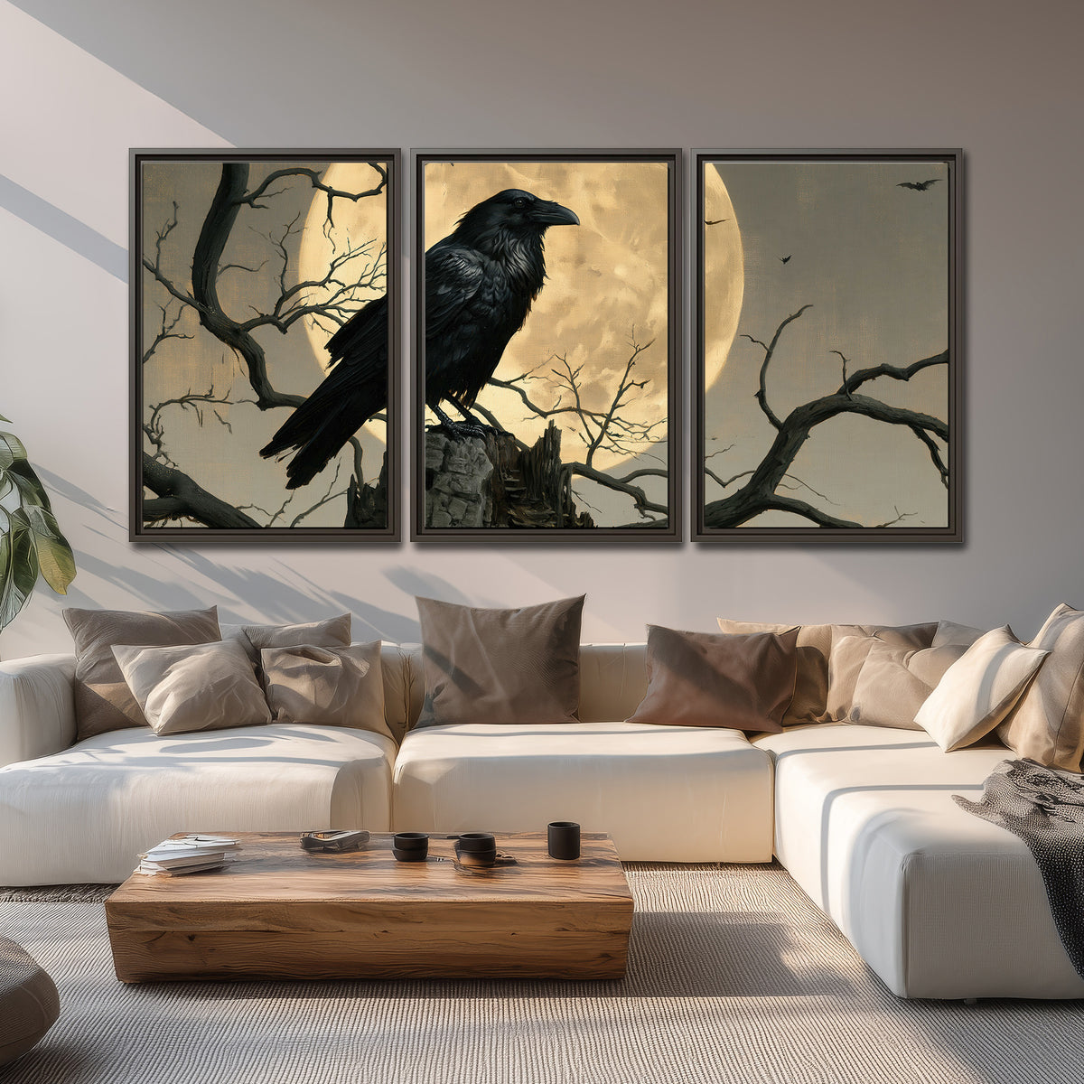 A black raven standing among bare branches in front of a large golden moon 3 piece framed canvas wall art displayed in a living room