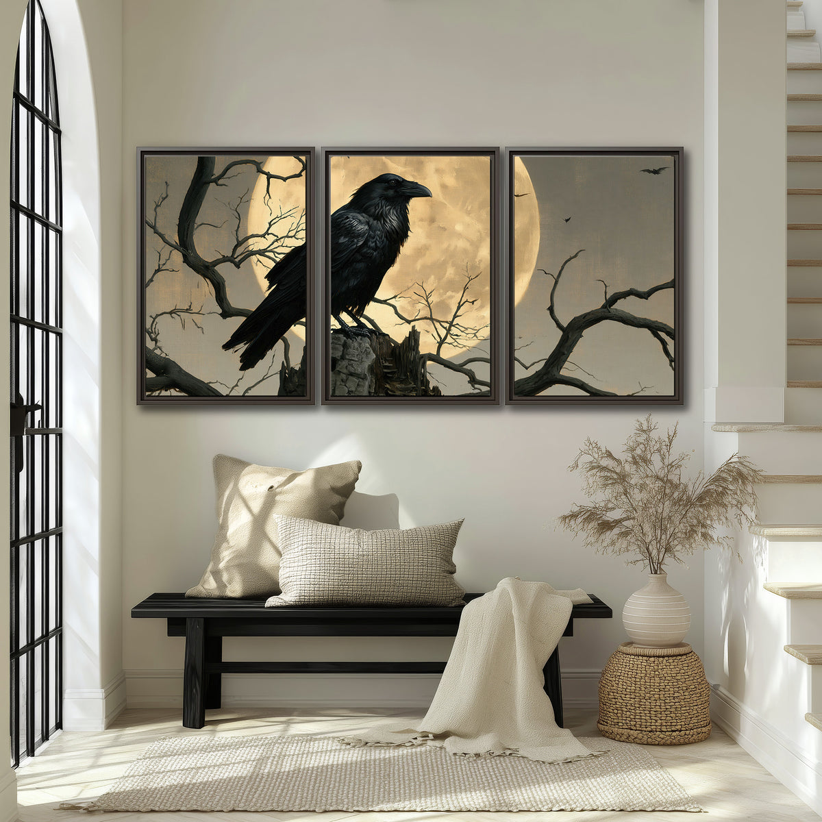 A black raven standing among bare branches in front of a large golden moon 3 piece framed canvas wall art displayed in a entryway