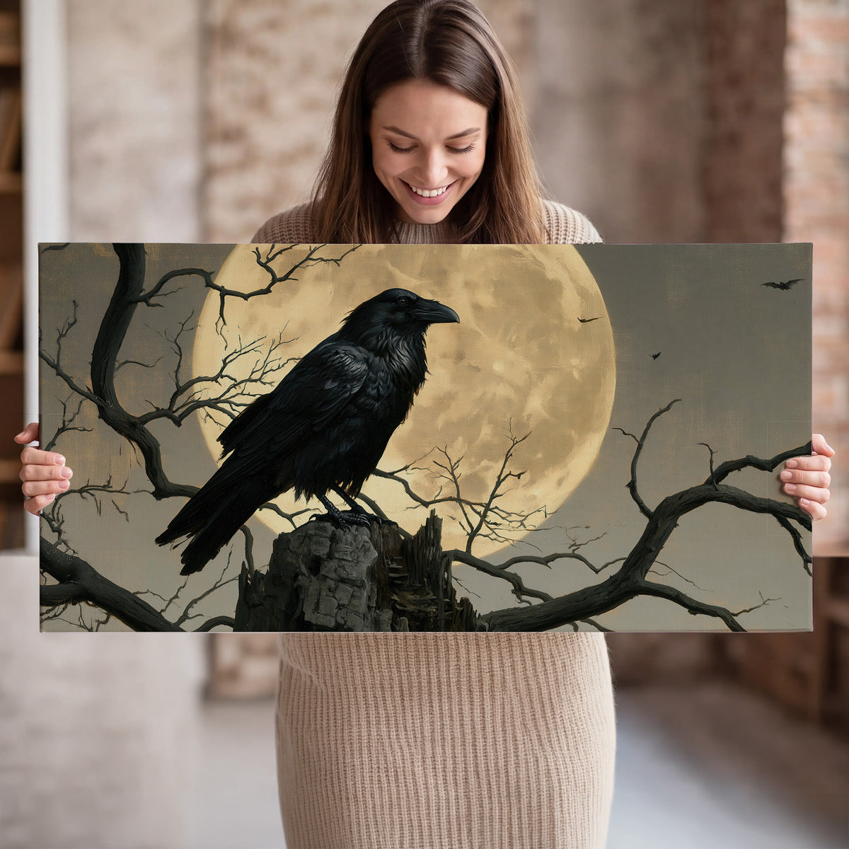 A black raven standing among bare branches in front of a large golden moon single canvas wall art held in hands