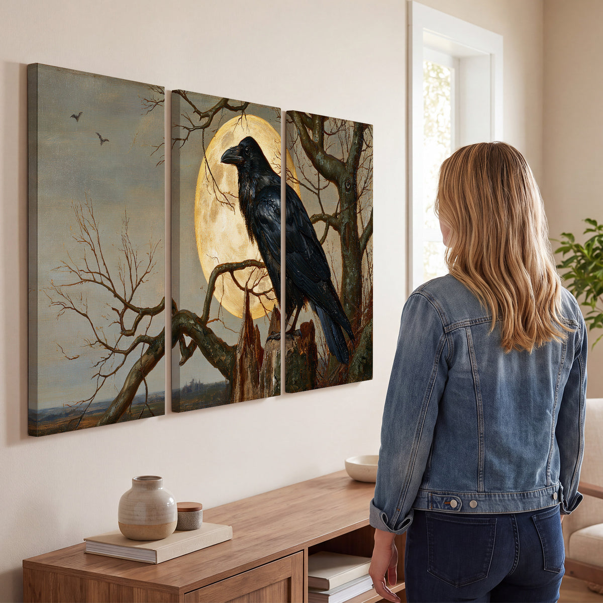 A dark raven perched on a branch beneath a warm moon in a shadowed woodland 3 piece canvas wall art three panel arrangement on a wall