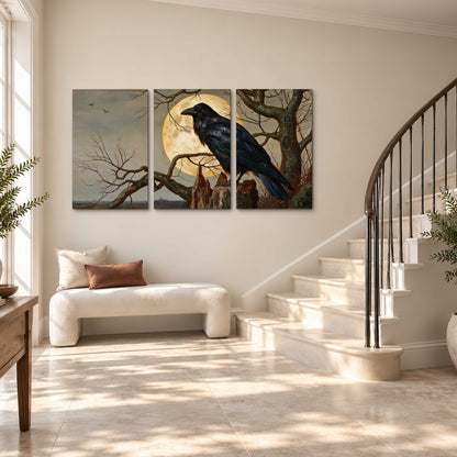 A dark raven perched on a branch beneath a warm moon in a shadowed woodland 3 piece canvas wall art styled in an interior
