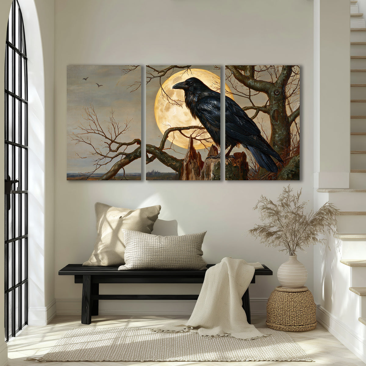 A dark raven perched on a branch beneath a warm moon in a shadowed woodland 3 piece canvas wall art displayed in a entryway