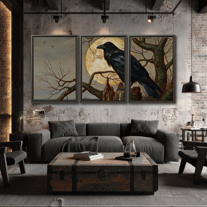 A dark raven perched on a branch beneath a warm moon in a shadowed woodland 3 piece framed canvas wall art displayed in a industrial room