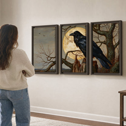 A dark raven perched on a branch beneath a warm moon in a shadowed woodland 3 piece framed canvas wall art three panel arrangement on a wall