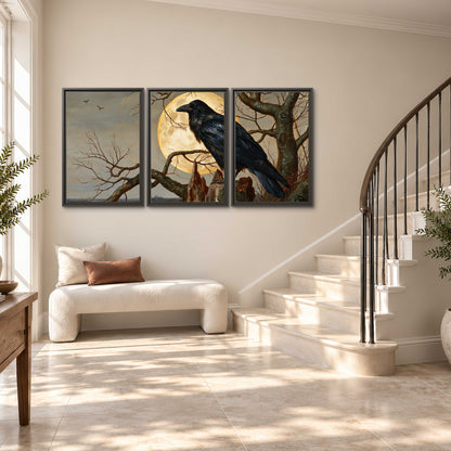 A dark raven perched on a branch beneath a warm moon in a shadowed woodland 3 piece framed canvas wall art styled in an interior
