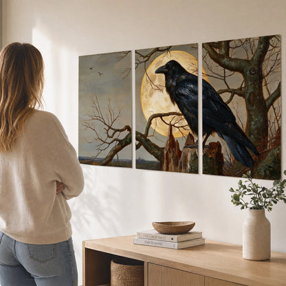 A dark raven perched on a branch beneath a warm moon in a shadowed woodland set of 3 poster prints three panel arrangement on a wall