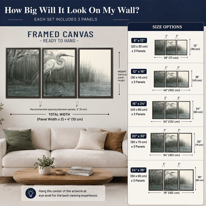 A pale long-legged heron standing beside tall reeds in a muted gray-green wetland 3 piece framed canvas wall art size guide above a sofa; room view is illustrative