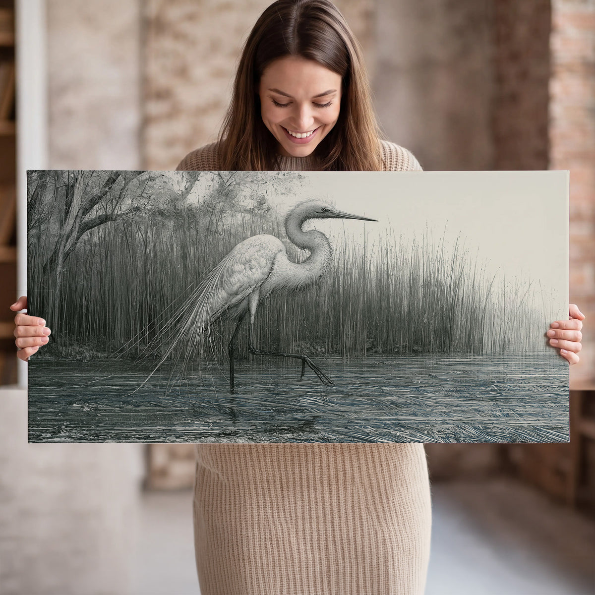 A pale long-legged heron standing beside tall reeds in a muted gray-green wetland single canvas wall art held in hands