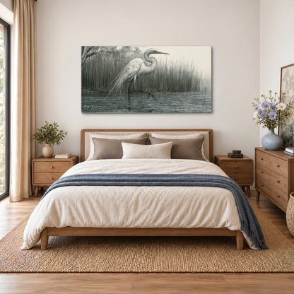 A pale long-legged heron standing beside tall reeds in a muted gray-green wetland single canvas wall art styled in an interior
