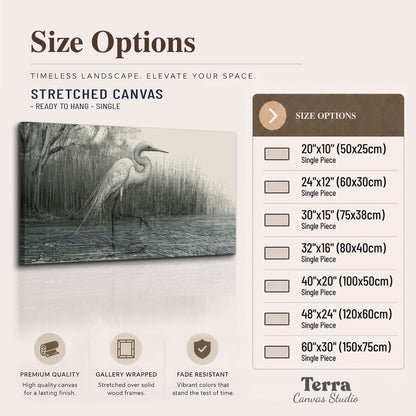 A pale long-legged heron standing beside tall reeds in a muted gray-green wetland single canvas wall art available dimensions