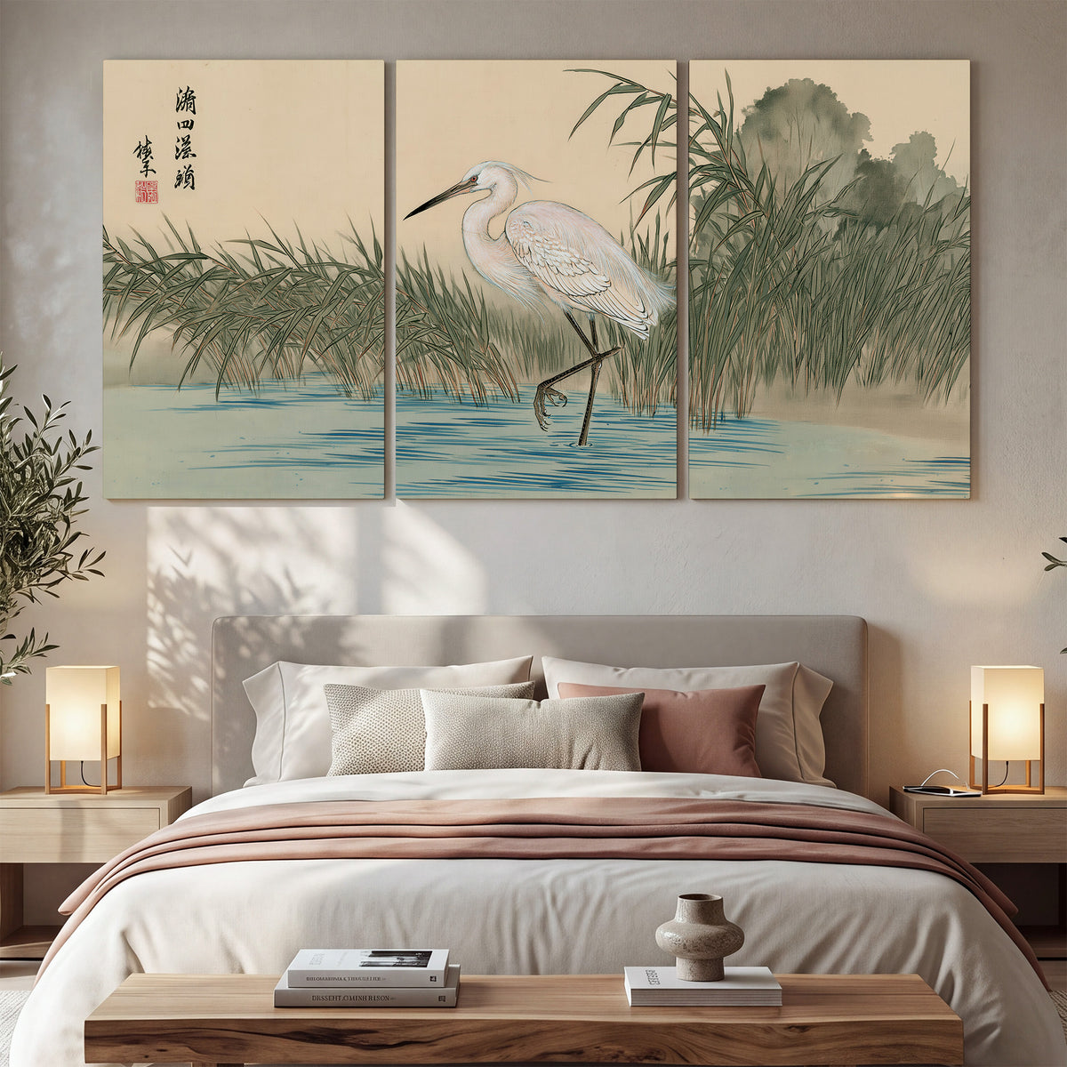 A white heron standing beside a quiet river with reeds and distant hills 3 piece canvas wall art displayed in a bedroom