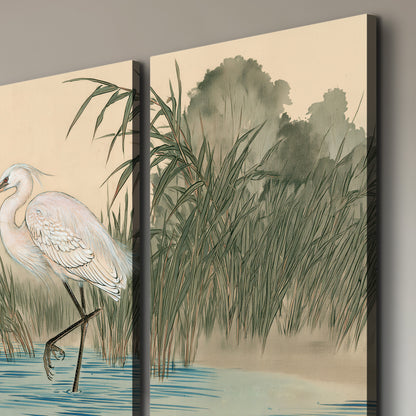 A white heron standing beside a quiet river with reeds and distant hills 3 piece canvas wall art room and product view