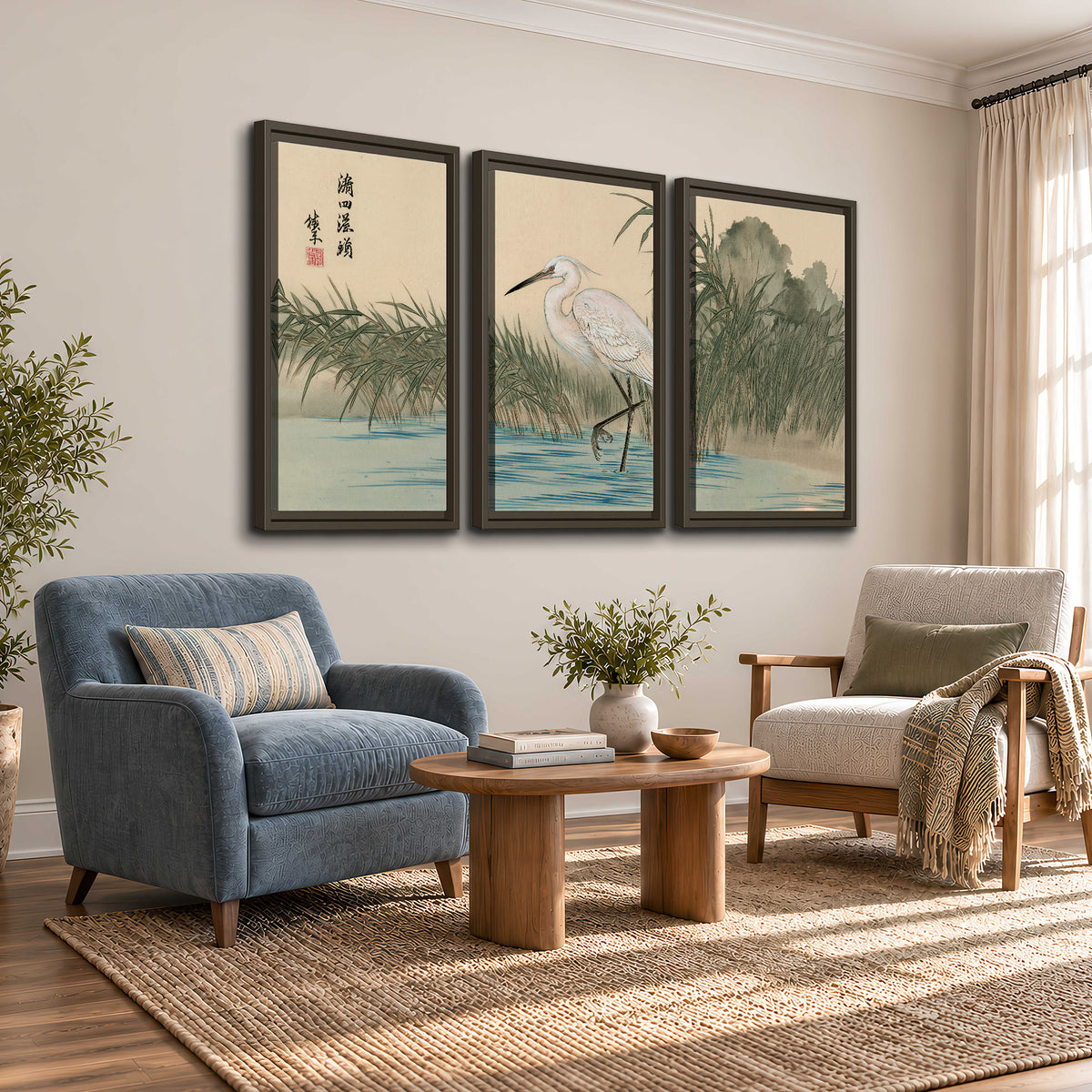 A white heron standing beside a quiet river with reeds and distant hills 3 piece framed canvas wall art styled in an interior