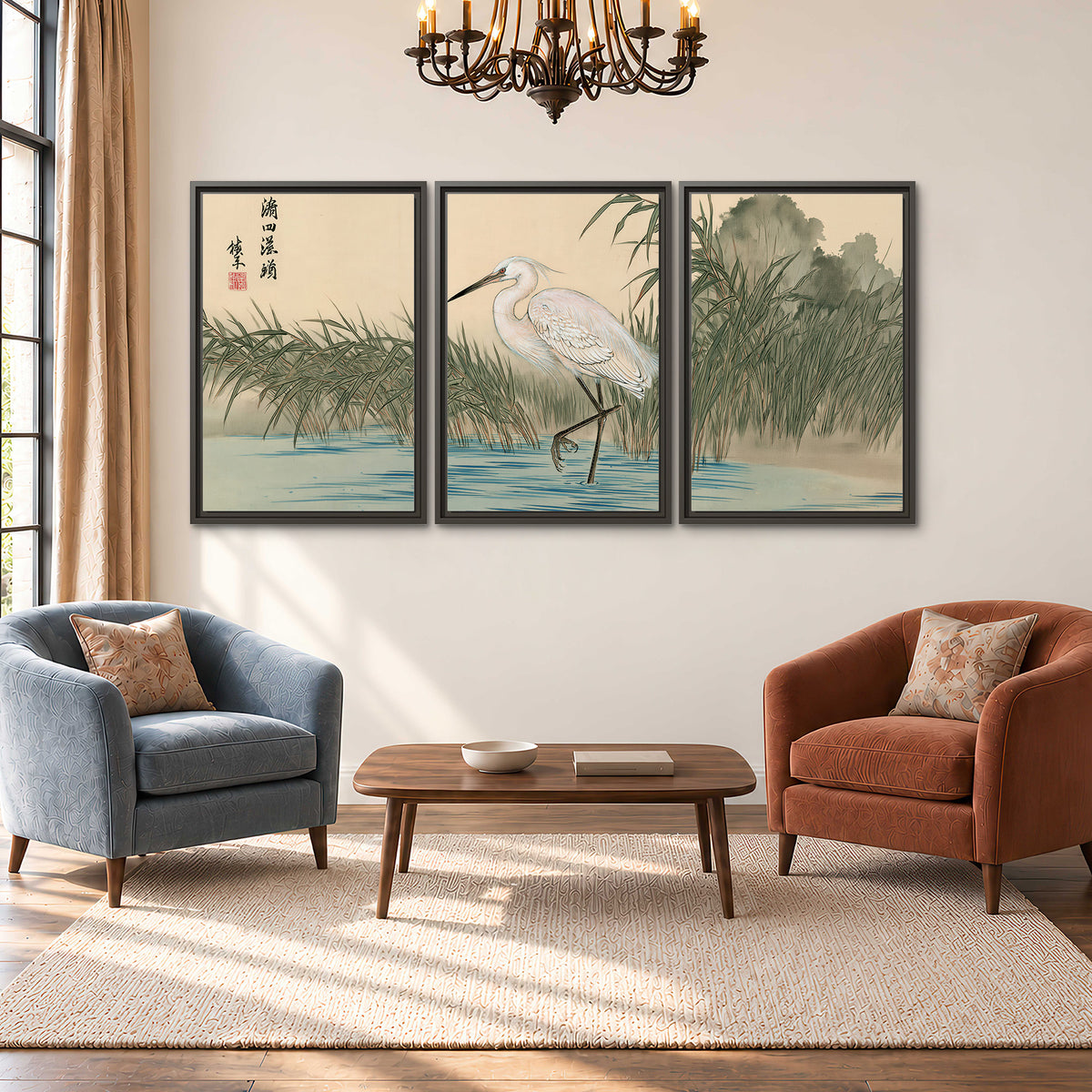 A white heron standing beside a quiet river with reeds and distant hills 3 piece framed canvas wall art styled in an interior