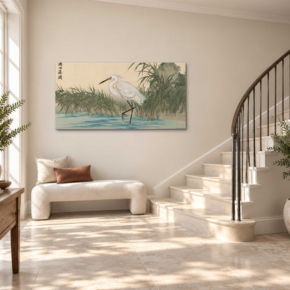 A white heron standing beside a quiet river with reeds and distant hills single canvas wall art styled in an interior