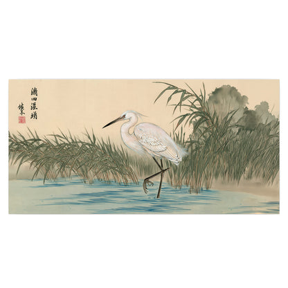 A white heron standing beside a quiet river with reeds and distant hills single poster print viewed straight on