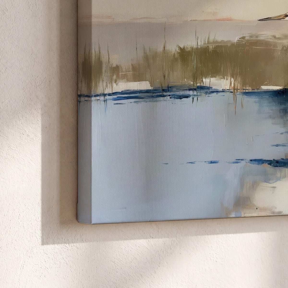 A slender heron standing in blue water among loose ochre and cream brushstrokes 3 piece canvas wall art material and edge close up