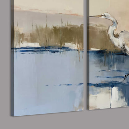 A slender heron standing in blue water among loose ochre and cream brushstrokes 3 piece canvas wall art room and product view