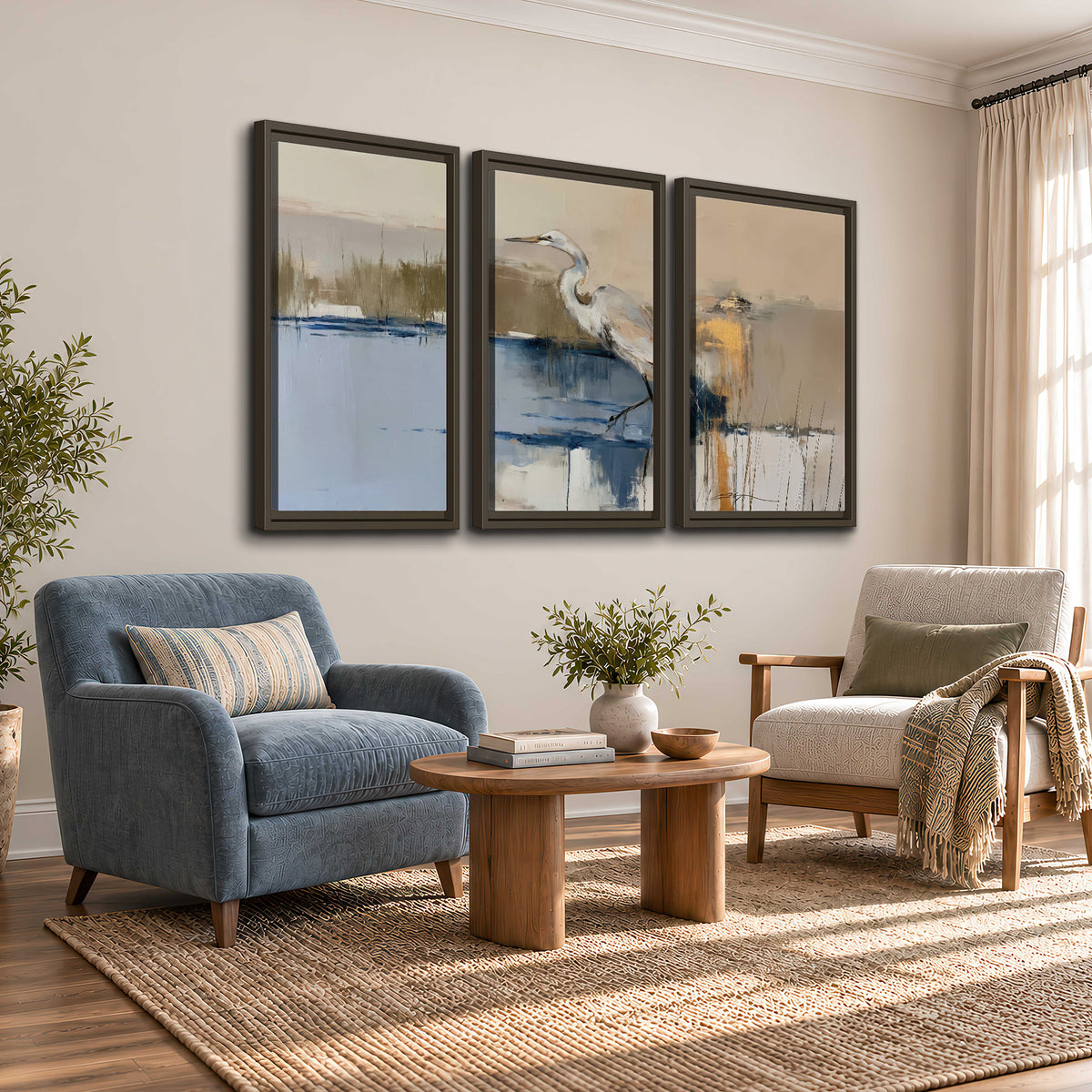 A slender heron standing in blue water among loose ochre and cream brushstrokes 3 piece framed canvas wall art styled in an interior