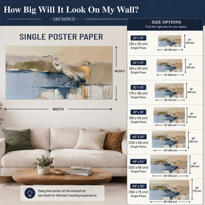 A slender heron standing in blue water among loose ochre and cream brushstrokes single poster print size guide above a sofa; room view is illustrative