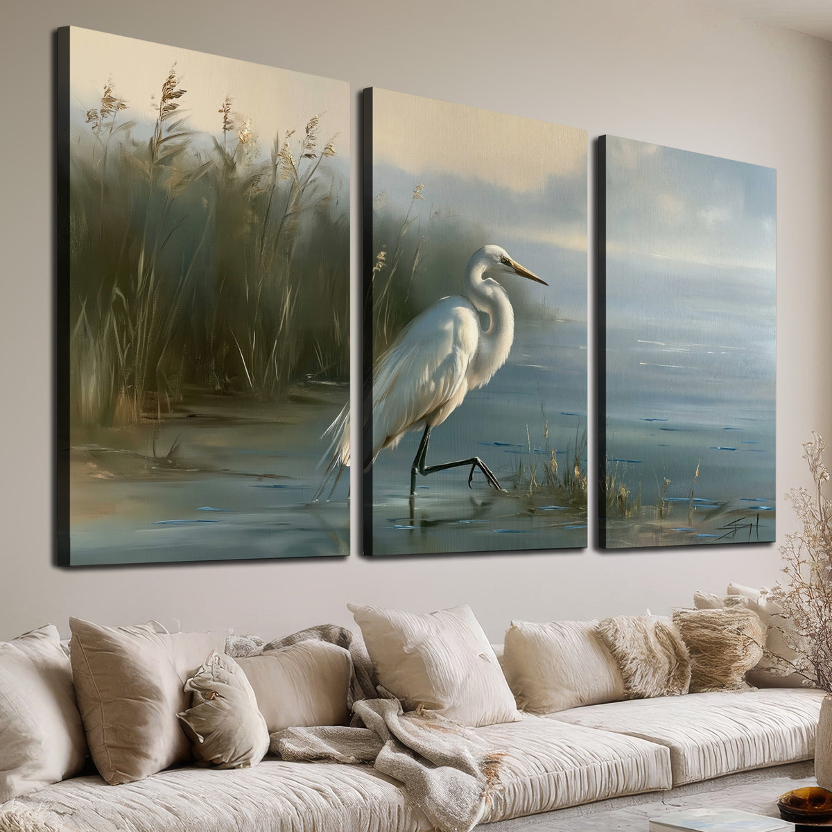 A white heron beside tall marsh grasses and still blue water 3 piece canvas wall art room and product view