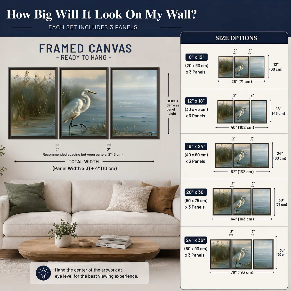 A white heron beside tall marsh grasses and still blue water 3 piece framed canvas wall art size guide above a sofa; room view is illustrative